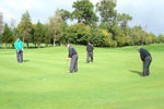 Pop Robson and John Craggs lining up putts on the 5th green